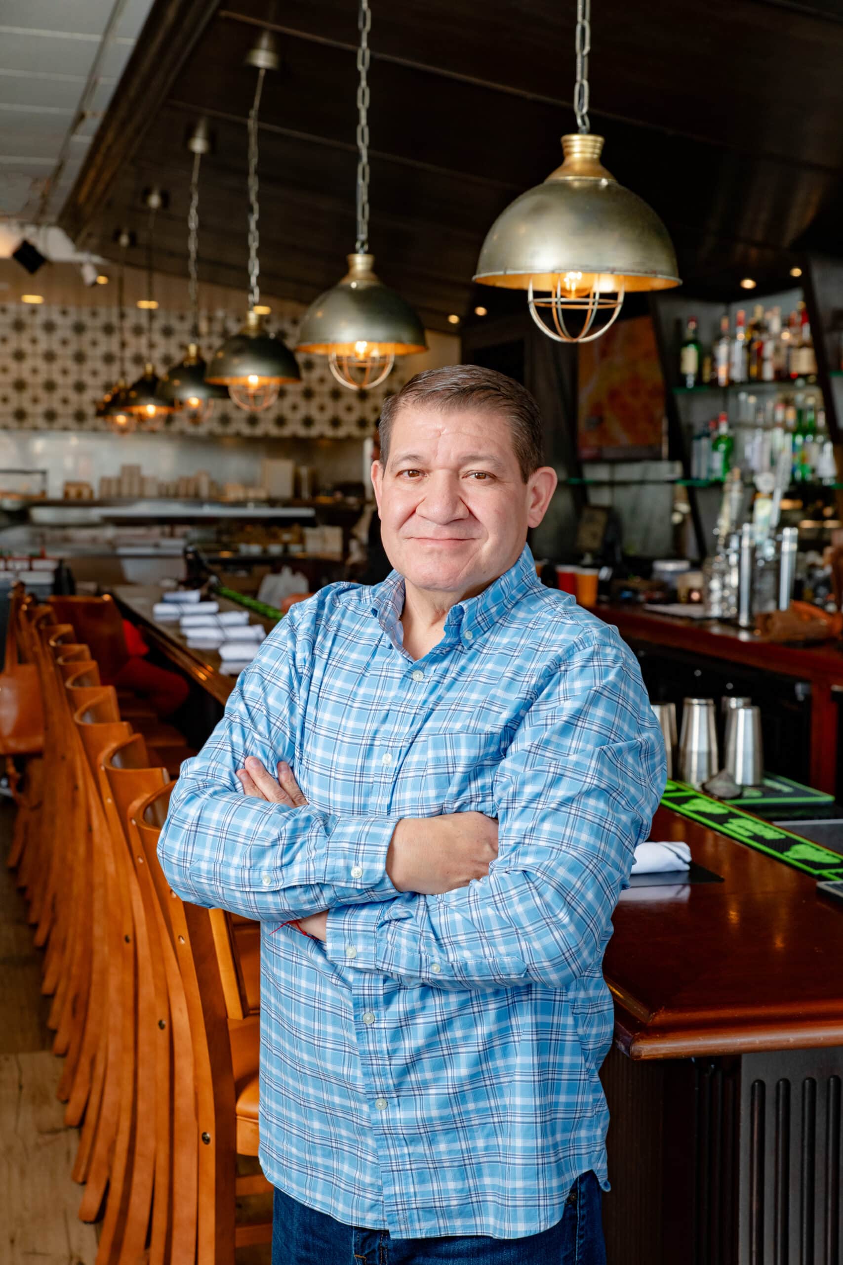 Los Arroyos team member at the bar